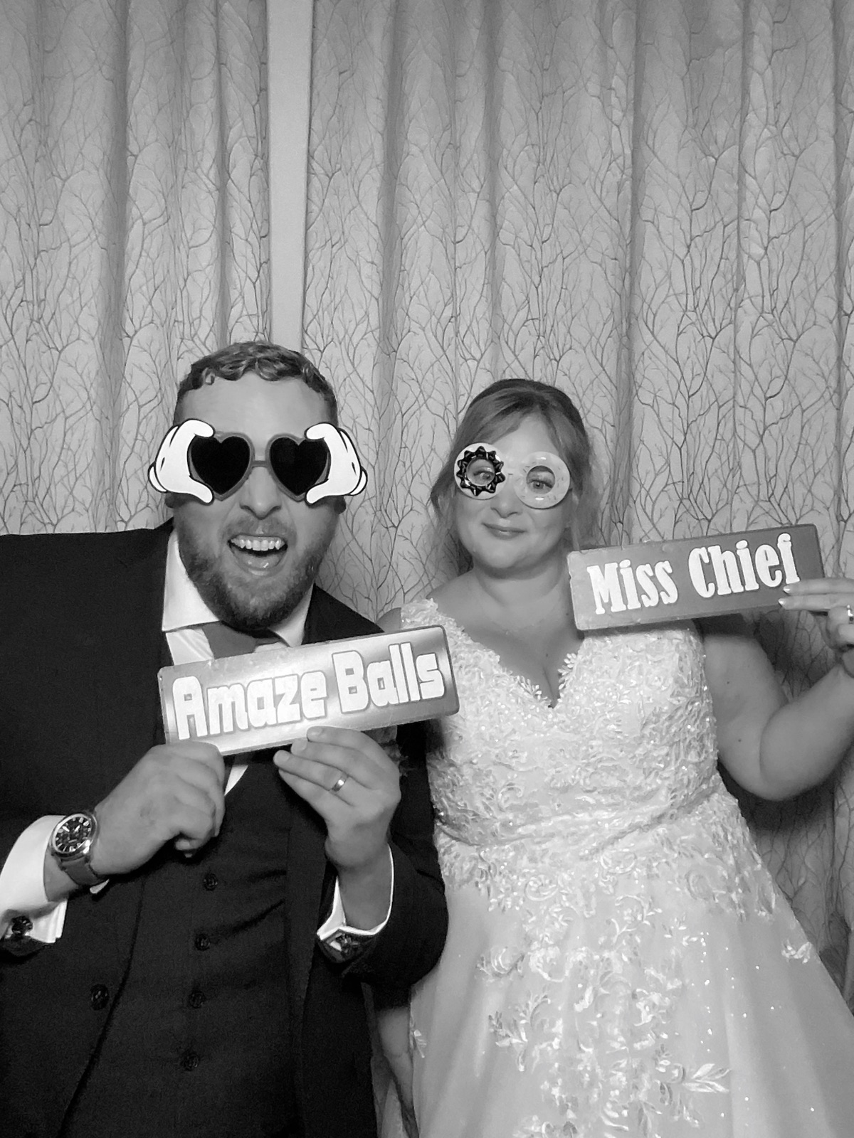 Newlyweds with photo booth props at a Gretna Green wedding