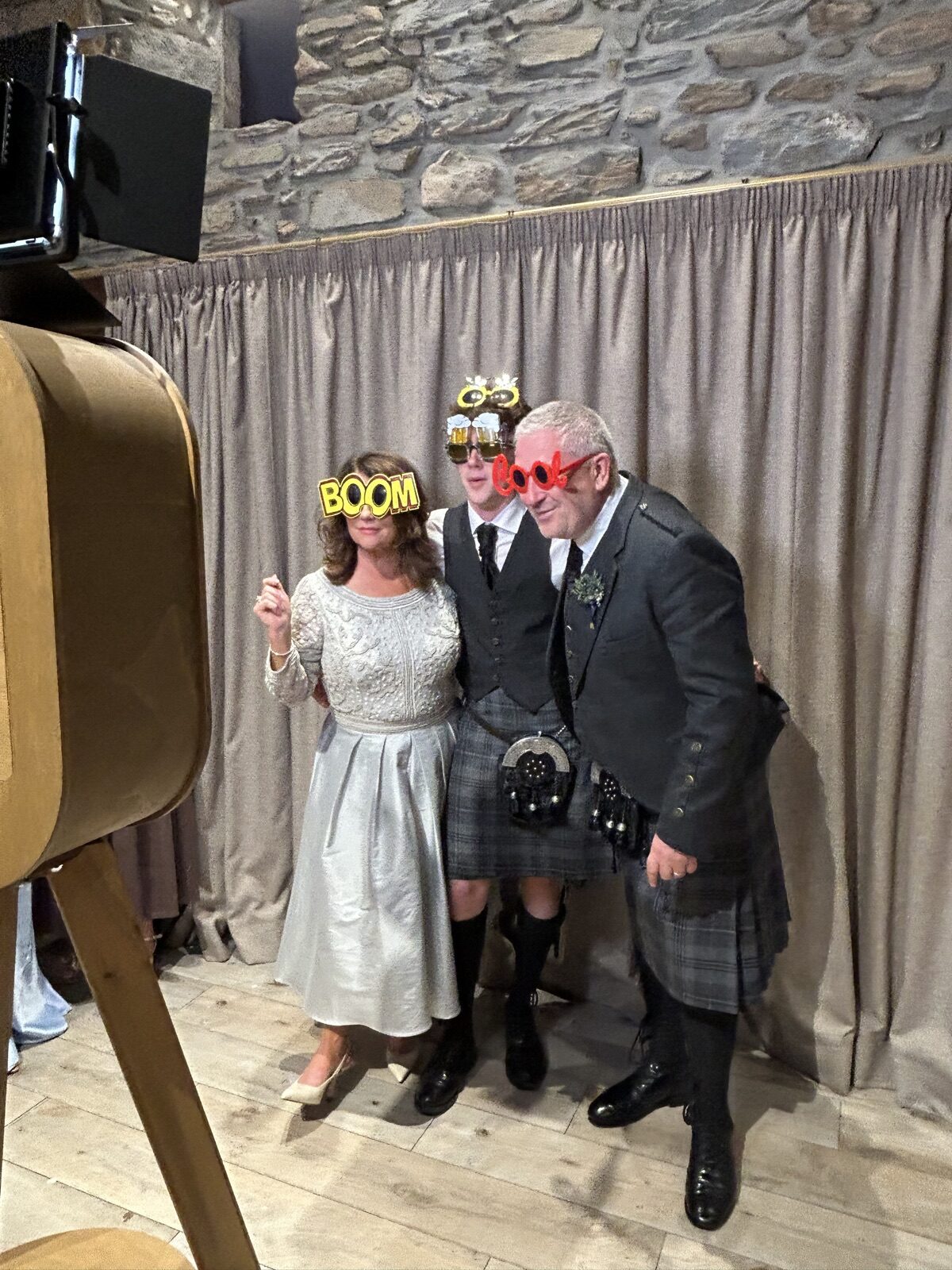 Bride and groom wearing fun props at a Windermere wedding